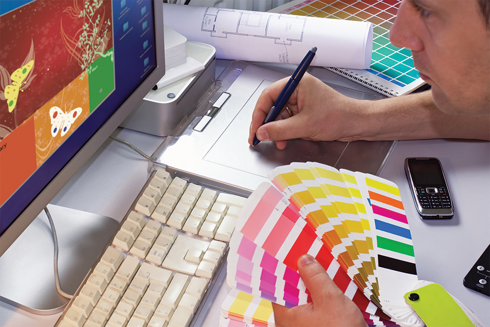 Graphic Designer holding a swatch book